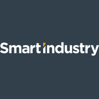 The image shows the Smart Industry logo with white text on a dark background. The letter i in industry is stylized with an orange top, resembling an upright exclamation mark.